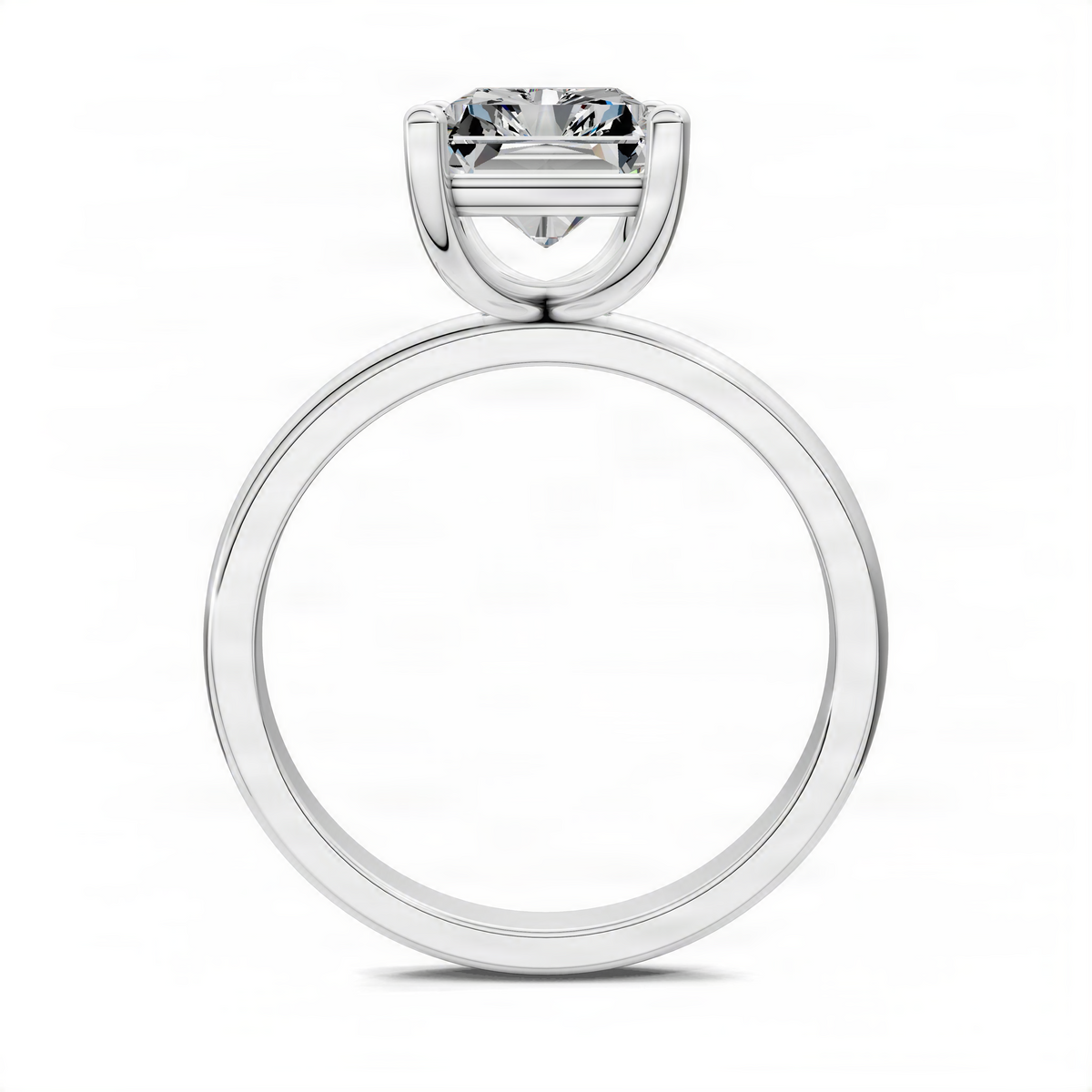 White gold solitaire engagement ring side view with round band and prong-set diamond