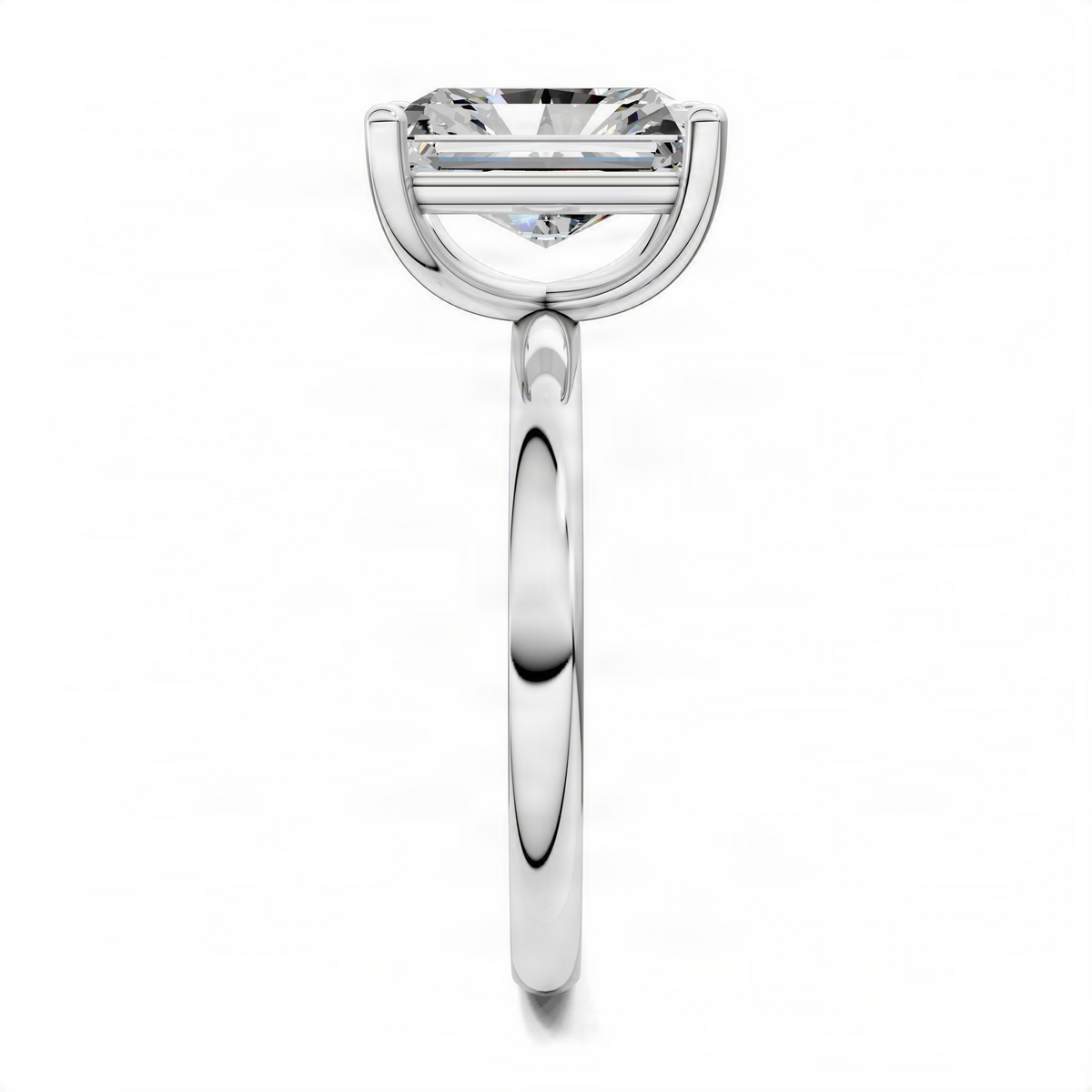 White gold solitaire engagement ring with rectangular cut center diamond