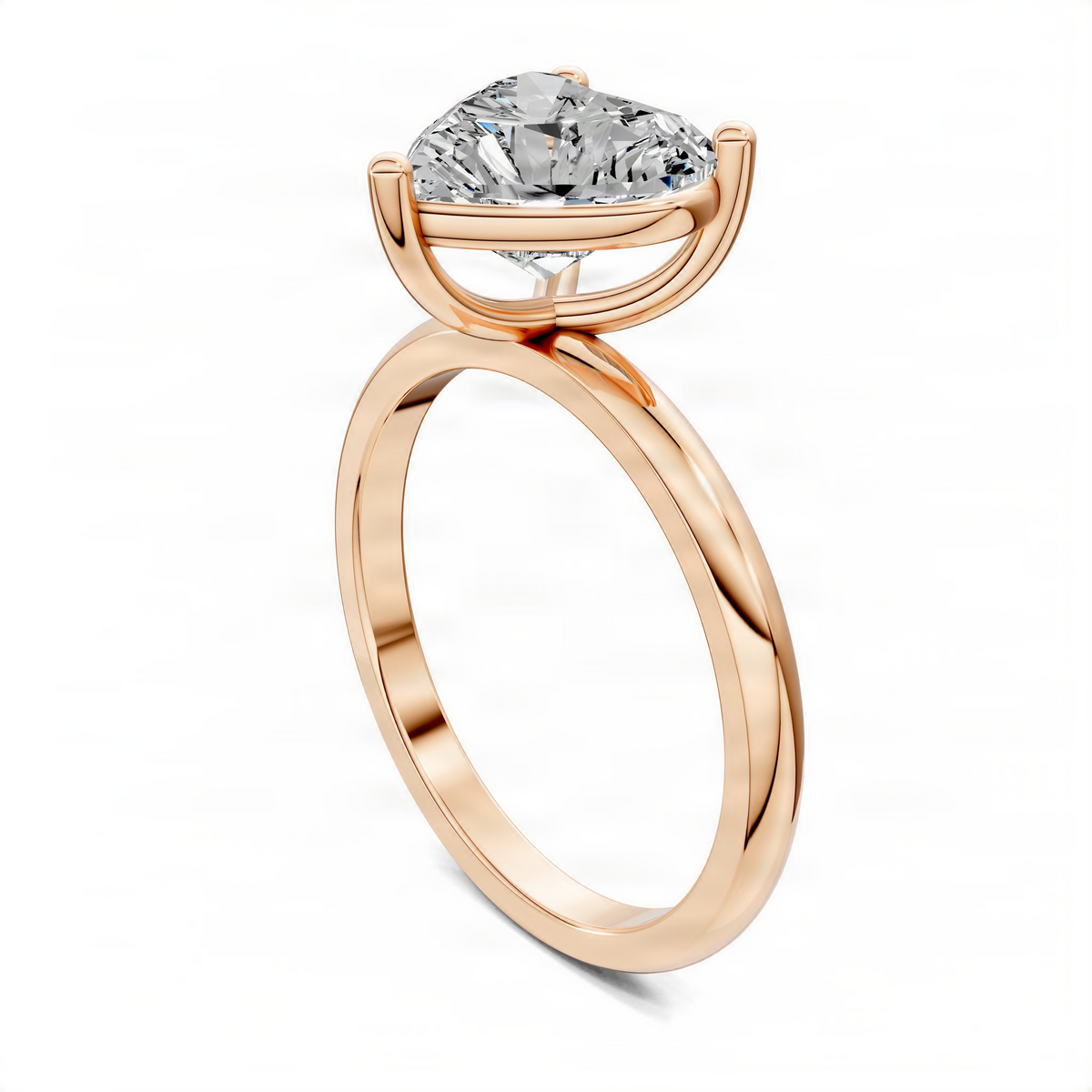 Rose-gold heart-shaped solitaire engagement ring, side view of prong-set center stone