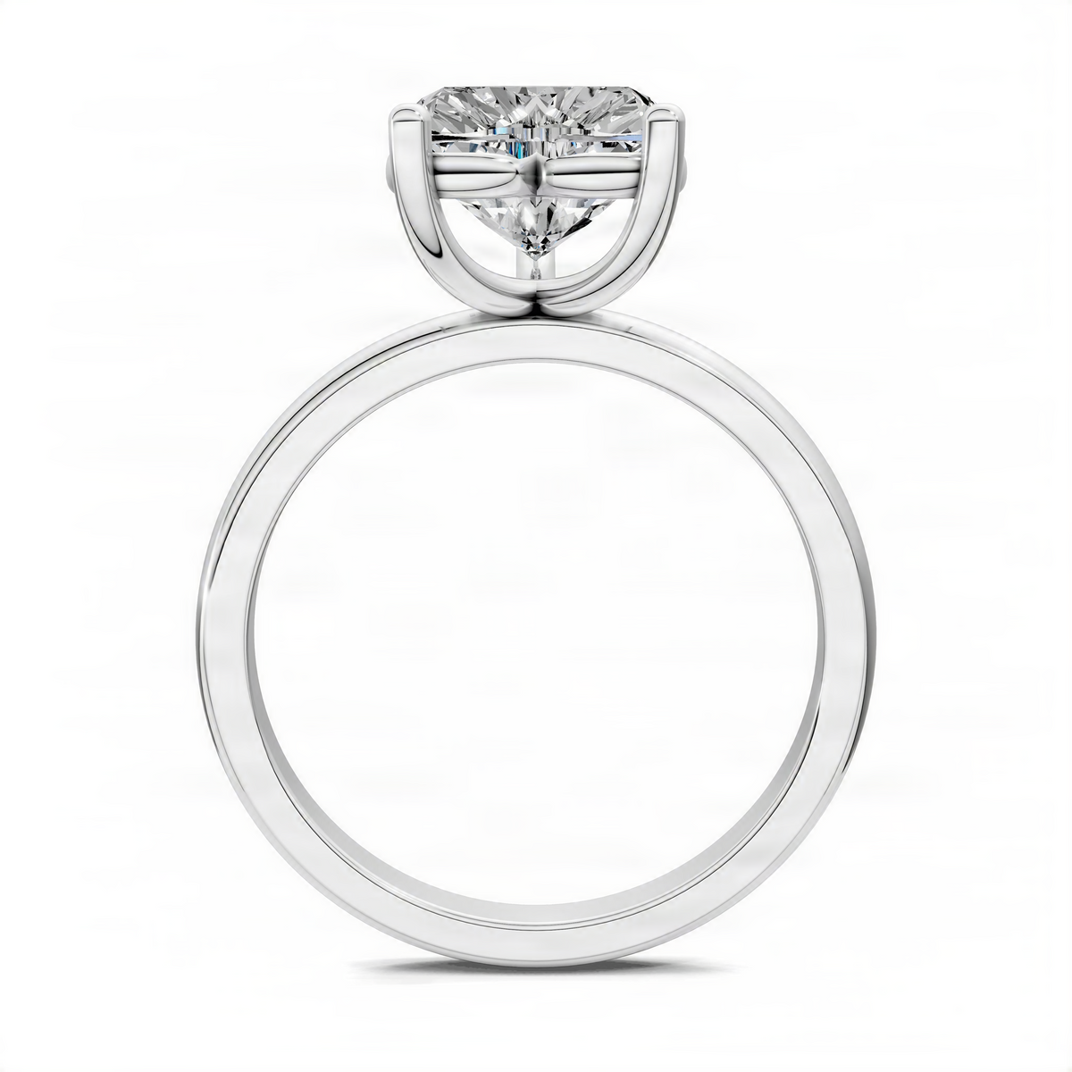 White gold solitaire engagement ring with heart-shaped diamond center and smooth round shank