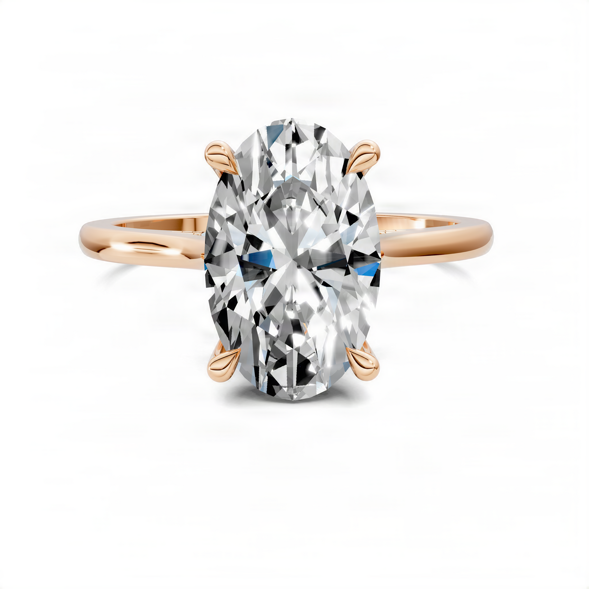 Oval-cut diamond ring in yellow gold with four leaf-like prongs