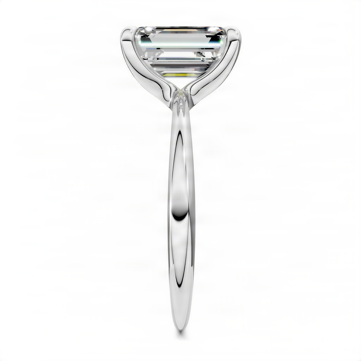 White gold solitaire ring with emerald-cut center stone and slender shank