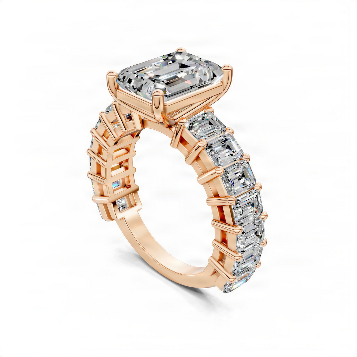 Rose gold engagement ring angled view with emerald-cut center and baguette pave band
