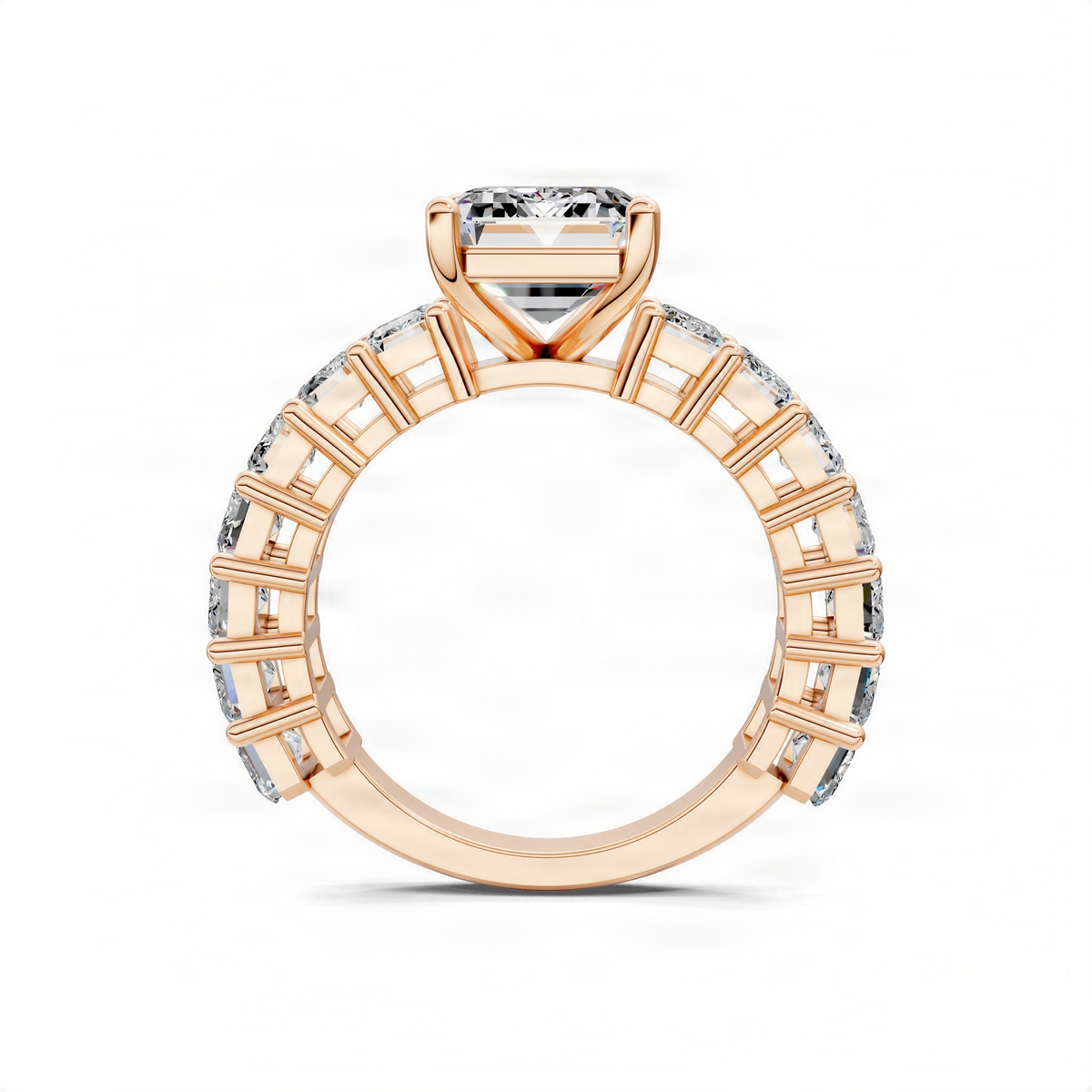 Rose gold engagement ring top view with emerald-cut center and baguette pave shank