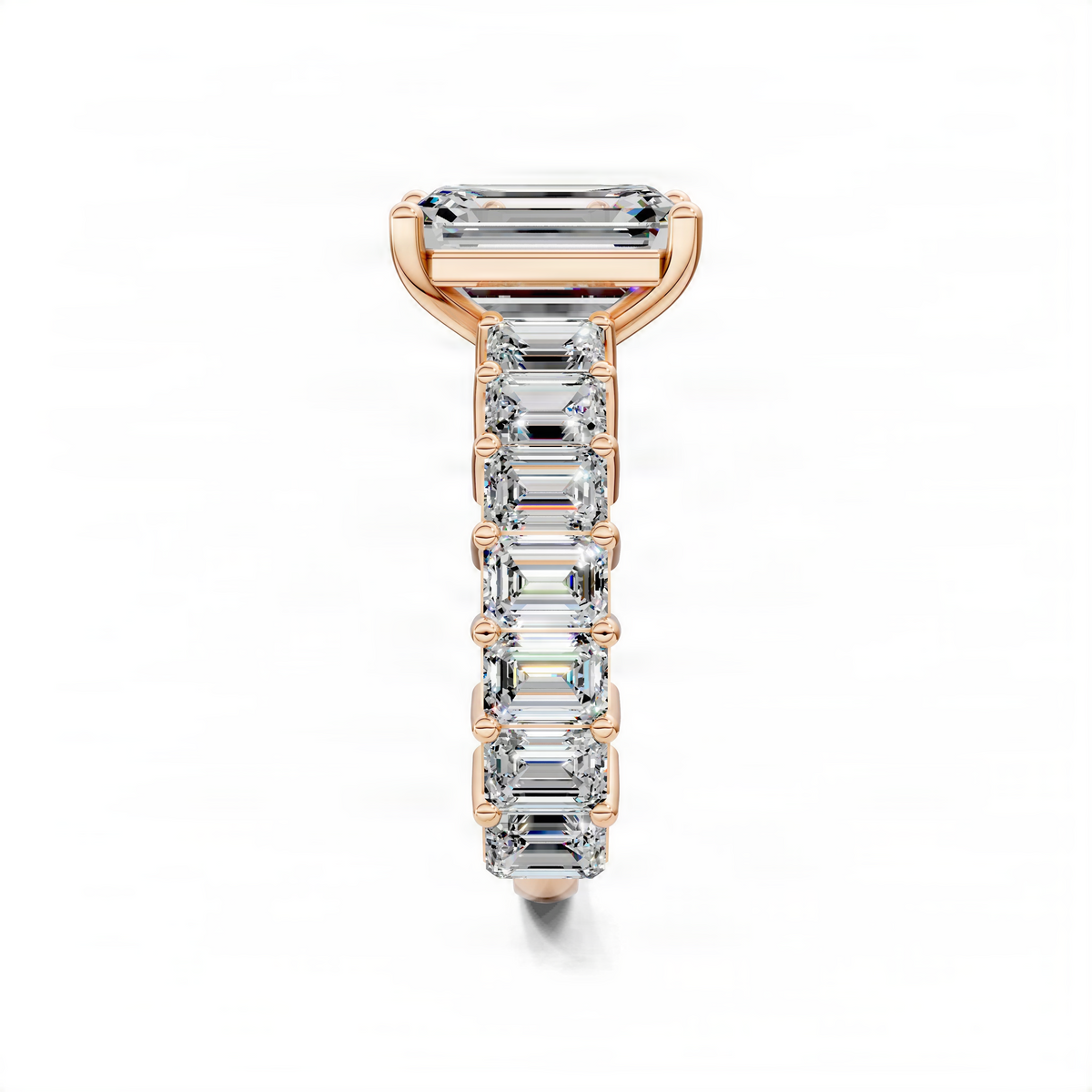 Rose gold engagement ring with emerald-cut center and stacked baguette pave design