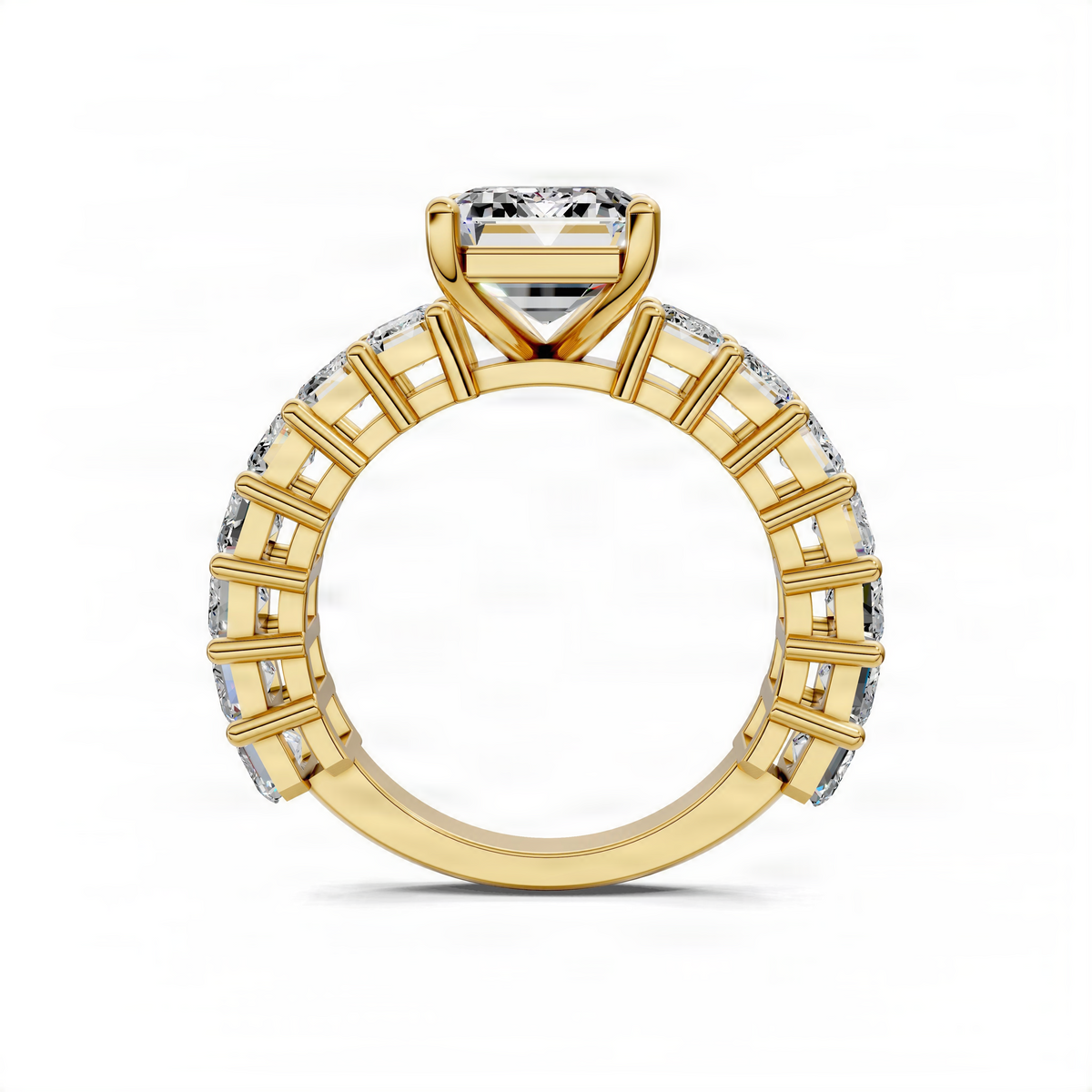 Yellow gold engagement ring top view with emerald-cut center and baguette pave shank