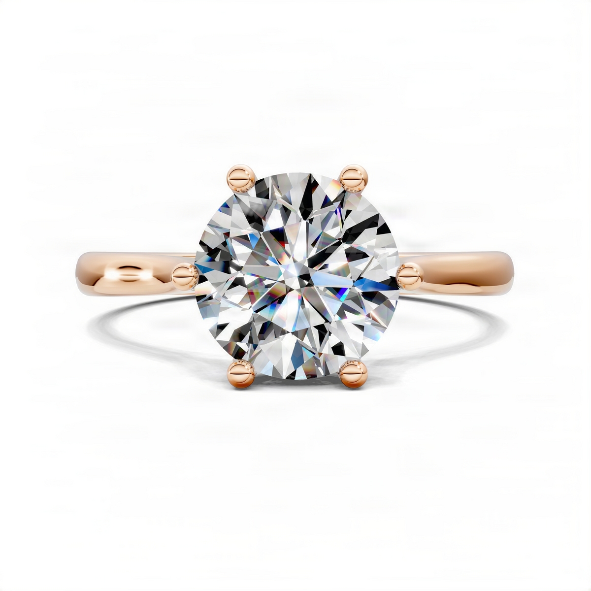 Rose gold solitaire engagement ring with round center diamond and polished band