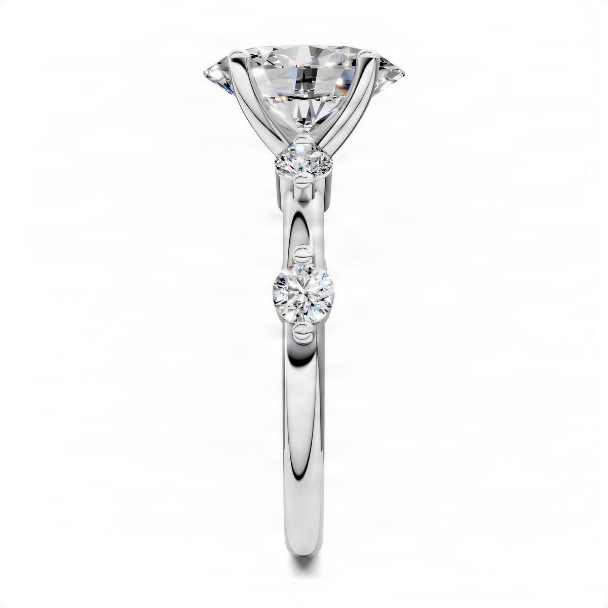 Platinum oval engagement ring with three prong-set stones, including two round accents