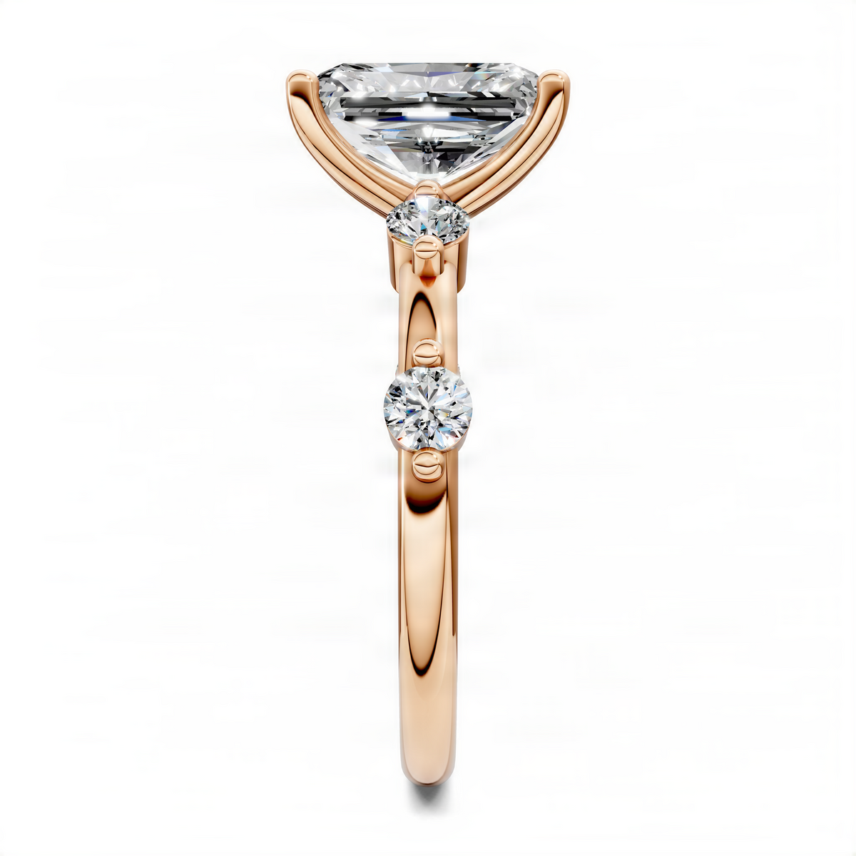 Rose gold round accent ring with square-cut top stone and two small round stones