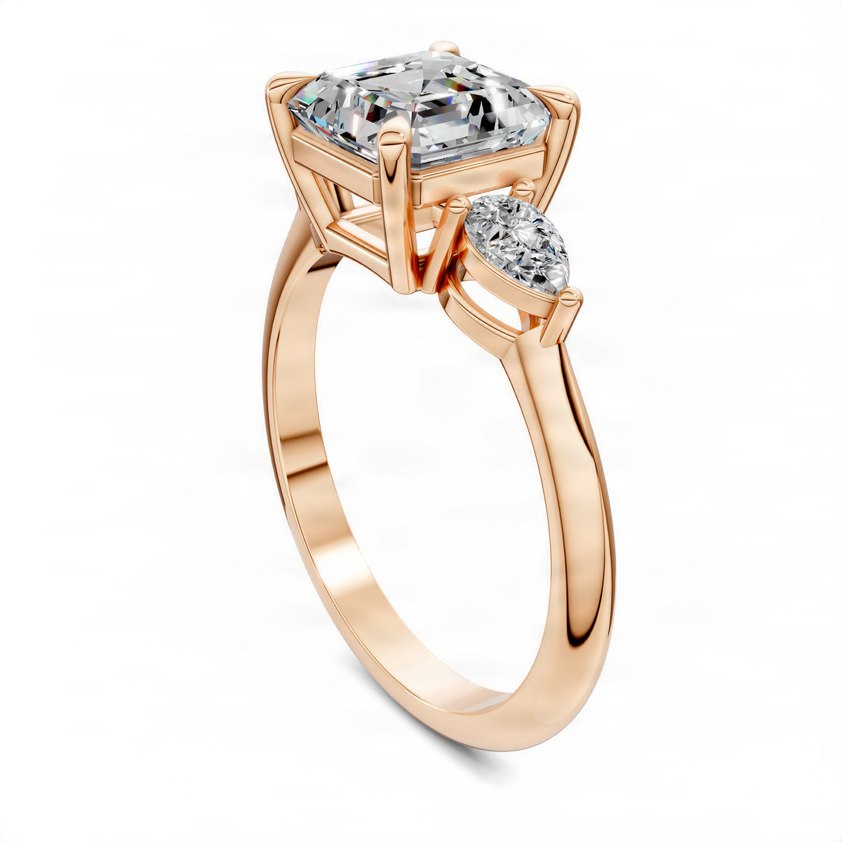 14k rose gold three-stone diamond ring, emerald-cut center with round side stones, angled