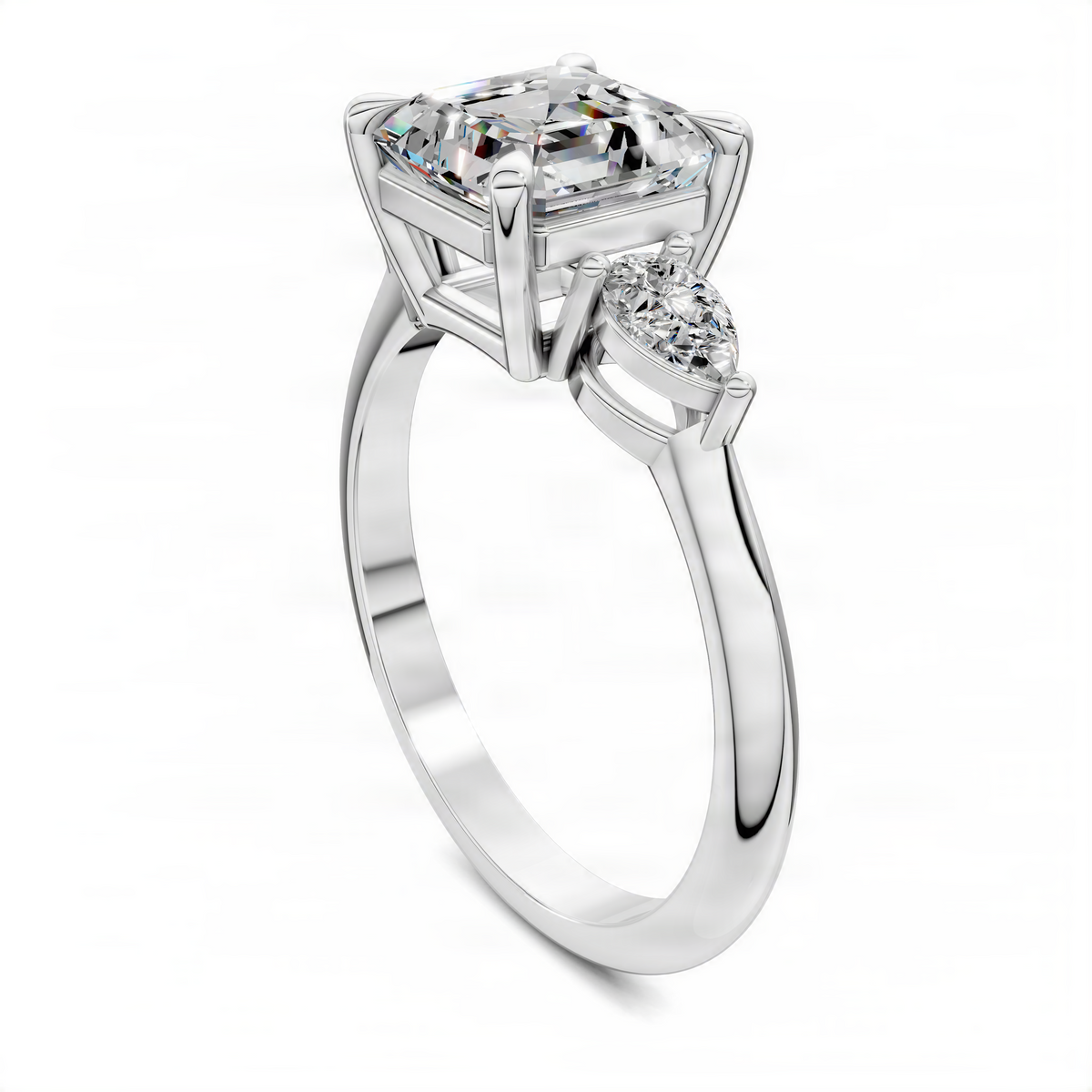 Three-stone ring with square step-cut center stone and round side stones, white metal