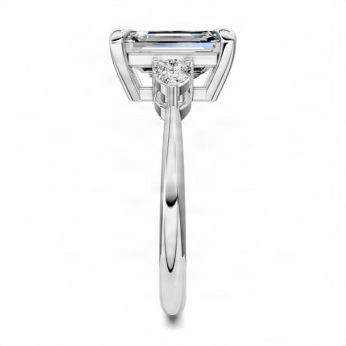 Three-stone diamond ring with emerald-cut center and round side stone, silver-toned metal band