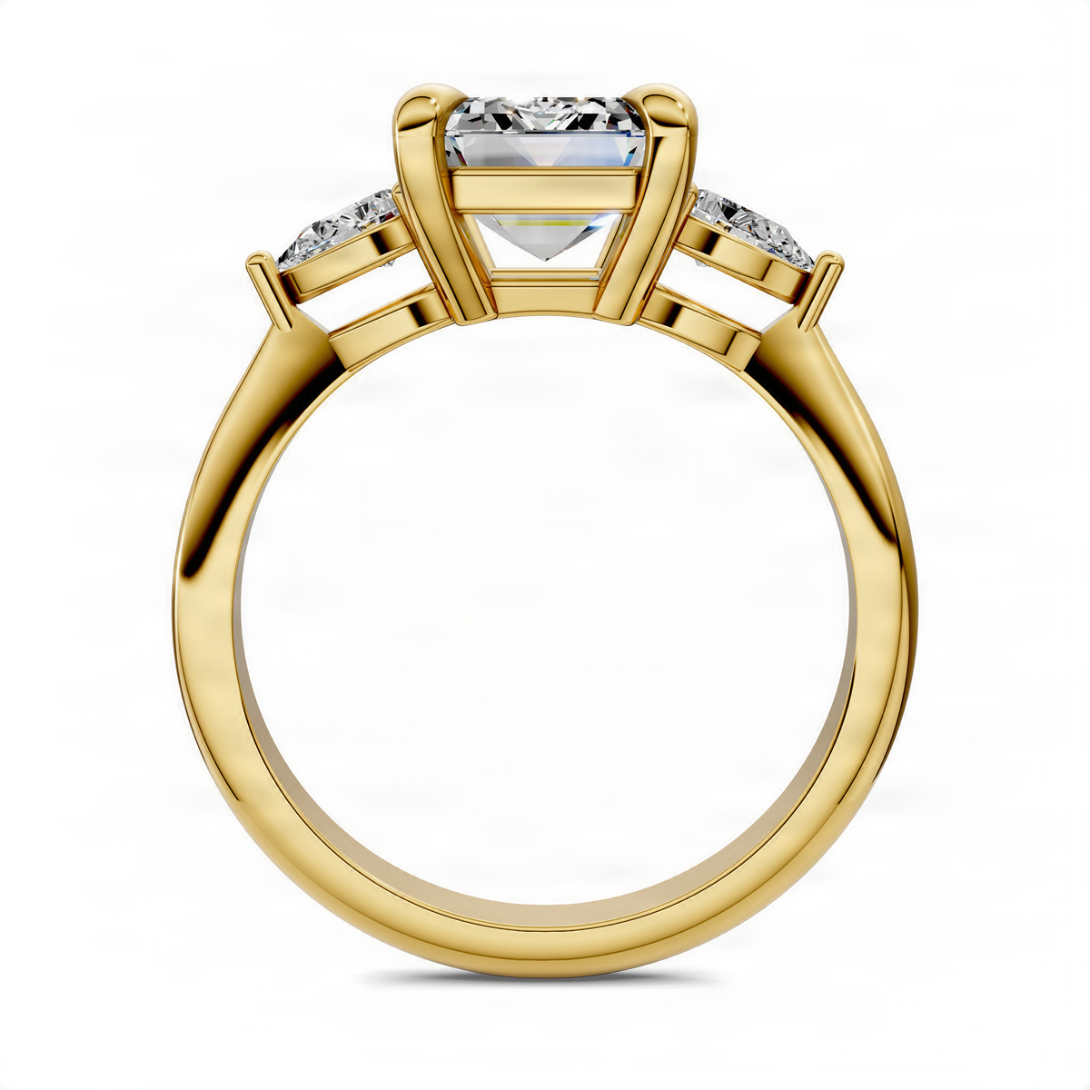 Three-stone diamond ring in yellow gold, emerald-cut center with side prong-set stones