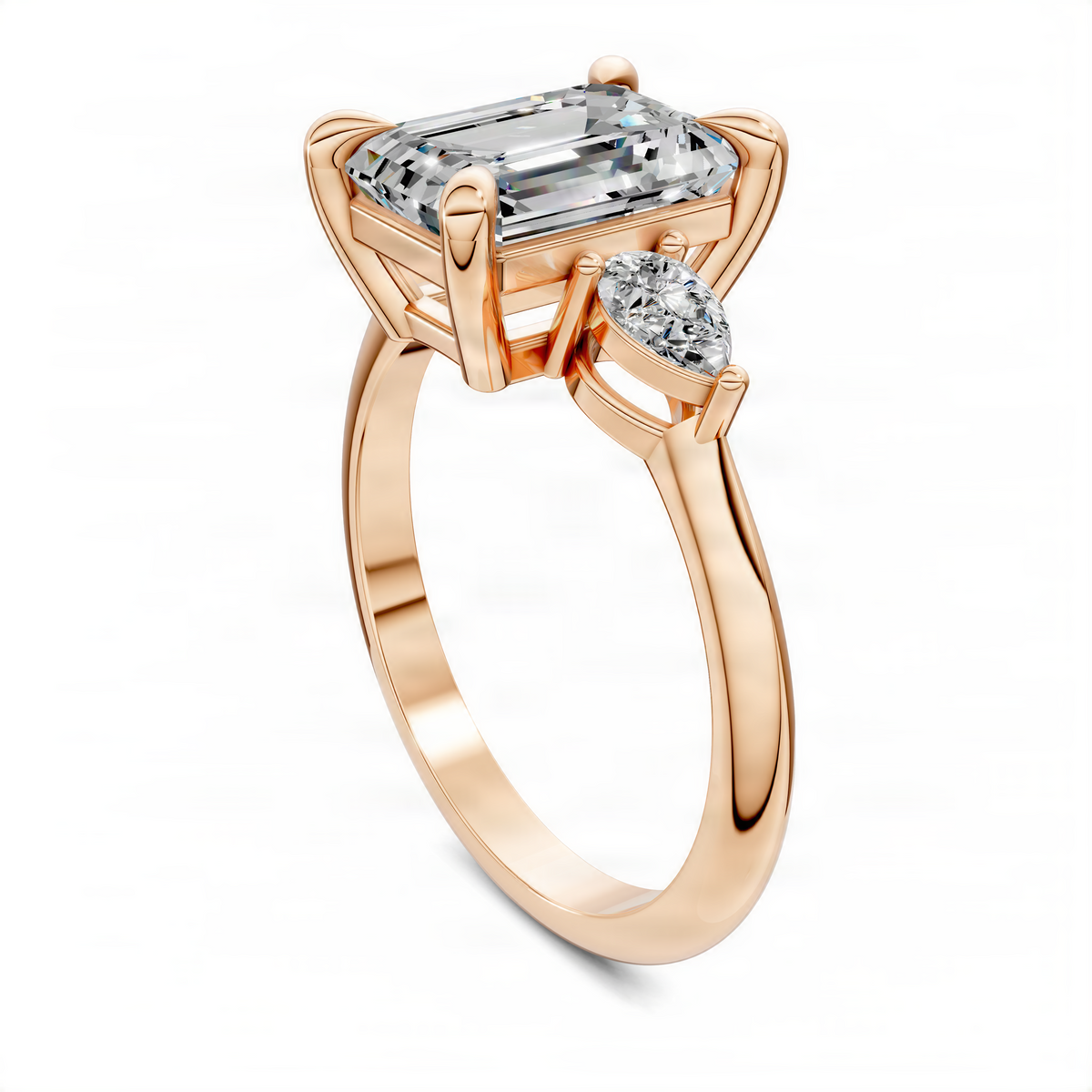 Three-stone diamond ring with emerald-cut center and round side stones, rose gold setting
