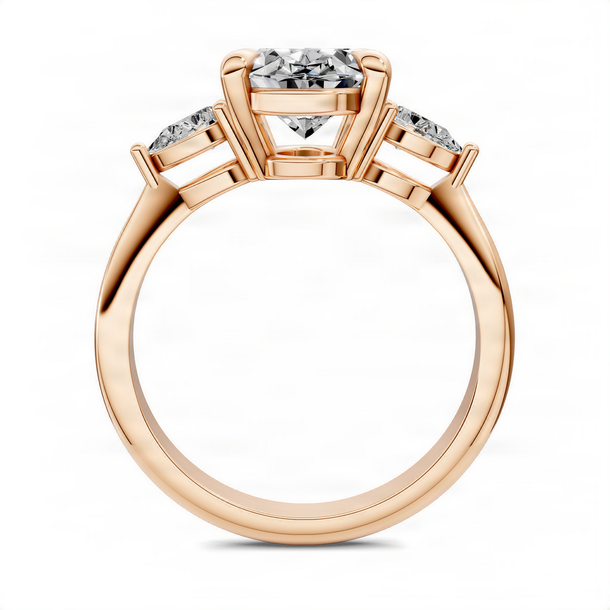 Rose gold oval three-stone diamond ring with central oval and two side stones