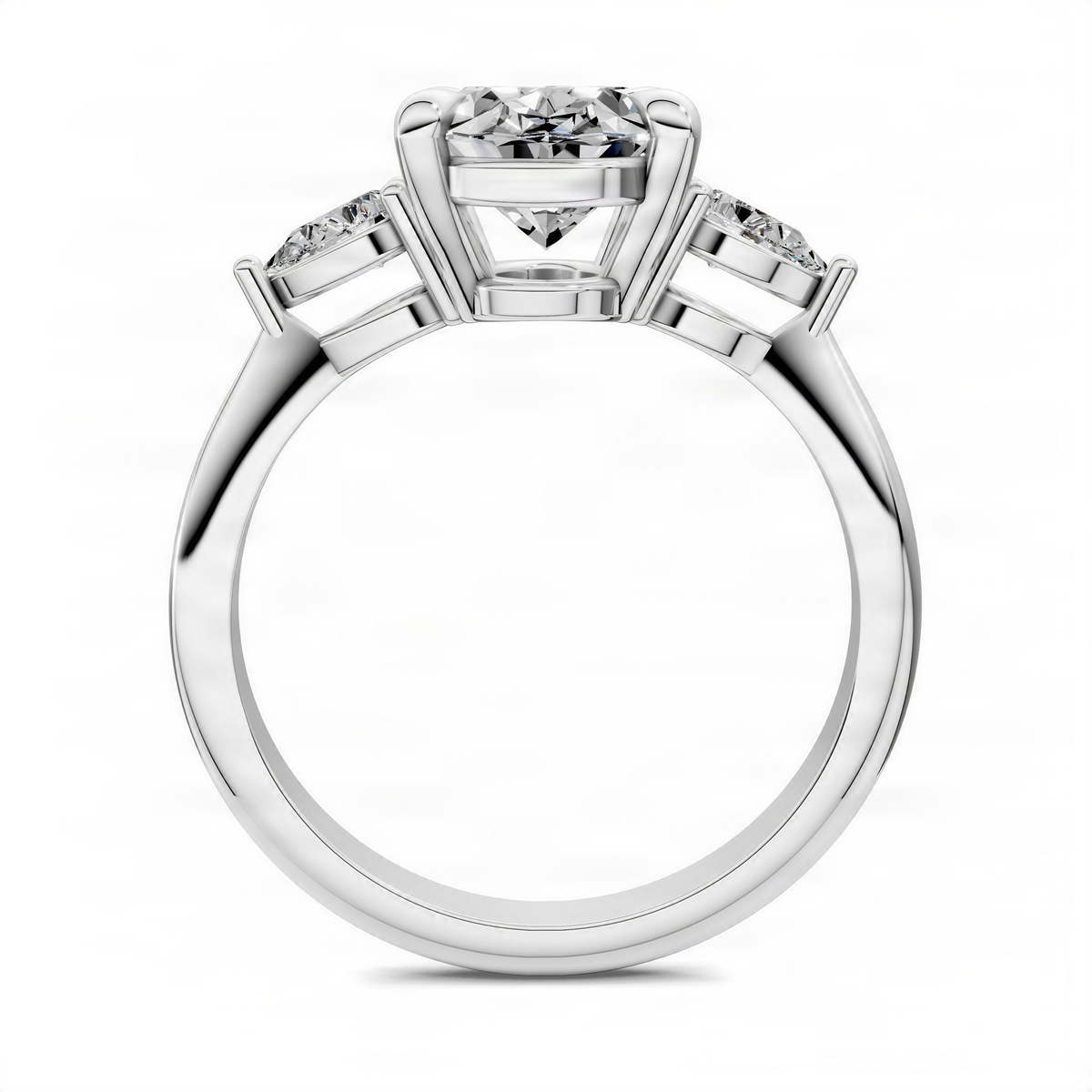 Oval three-stone ring with prong-set oval center and two side stones, white metal band