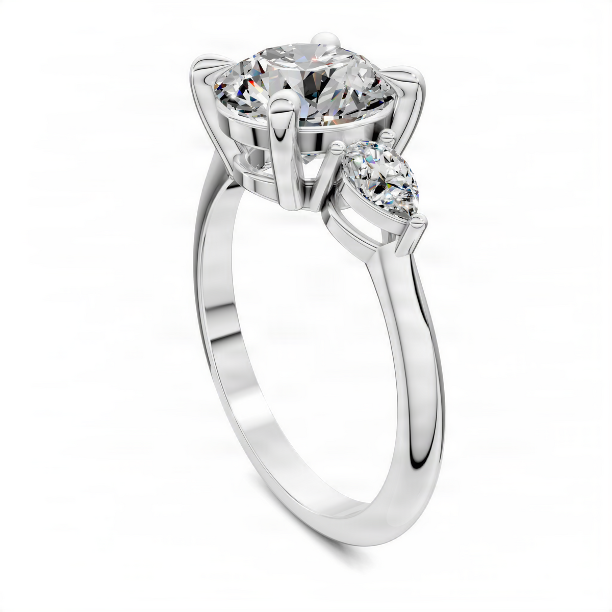 Round three-stone ring in white gold, prong-set center diamond with two side diamonds