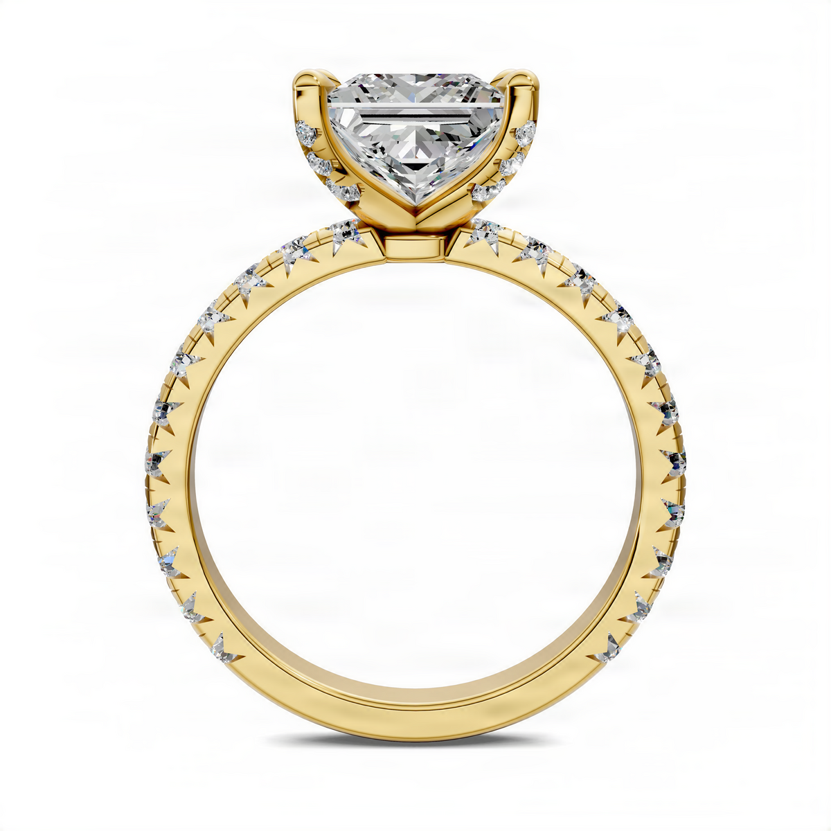 Gold ring with princess-cut center stone and claw-set accent stones on the band