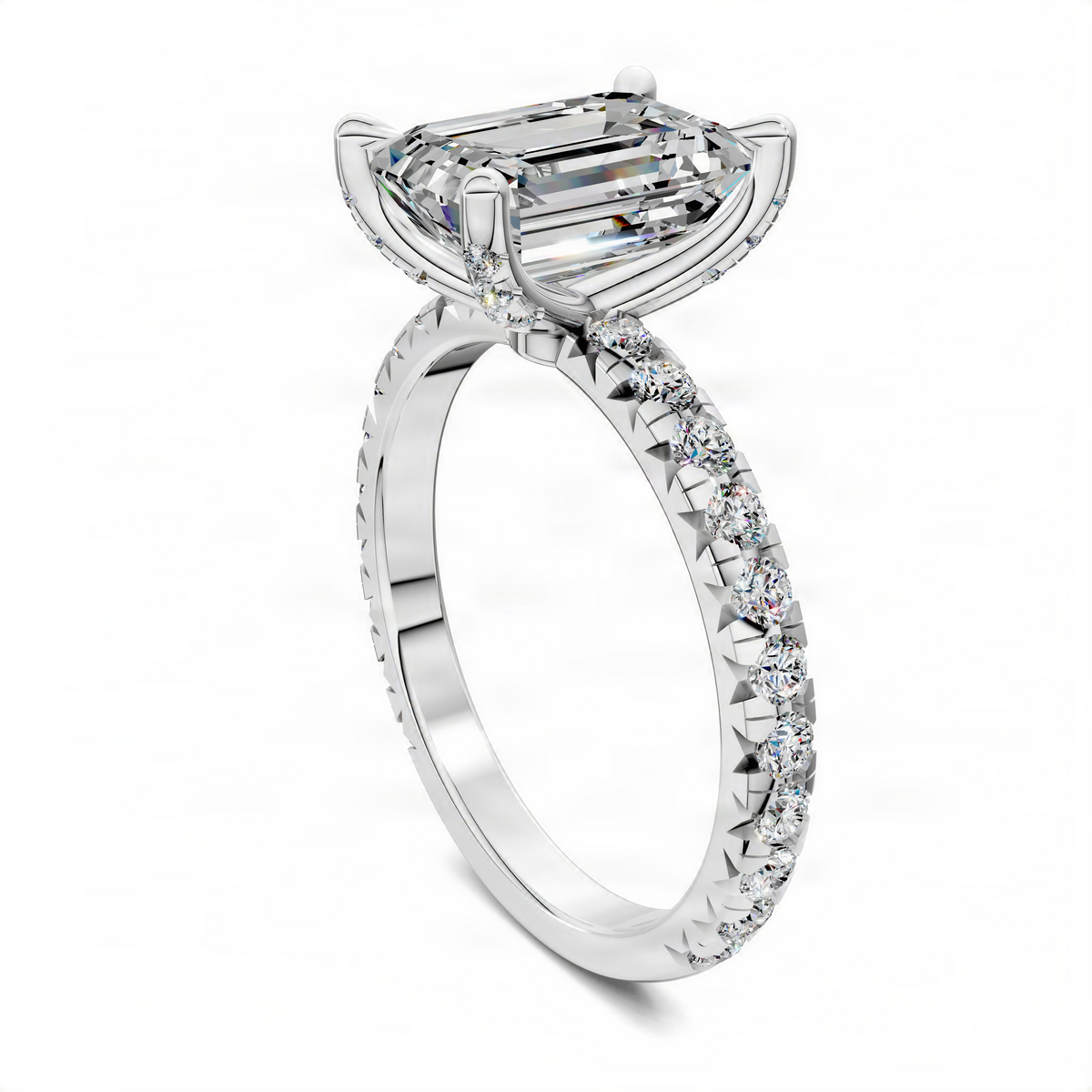 Emerald-cut diamond accent ring in white metal with pavé band and claw setting