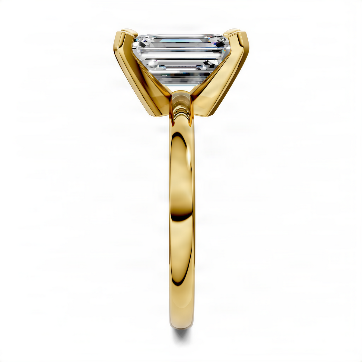 Yellow gold solitaire ring with emerald-cut center stone and four-prong setting