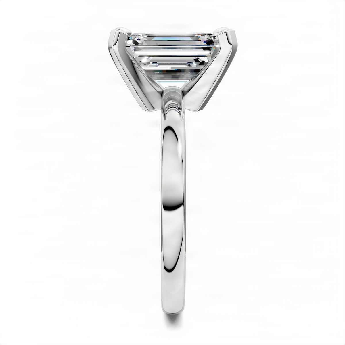 Emerald-cut solitaire ring with four-prong setting, silver-tone band