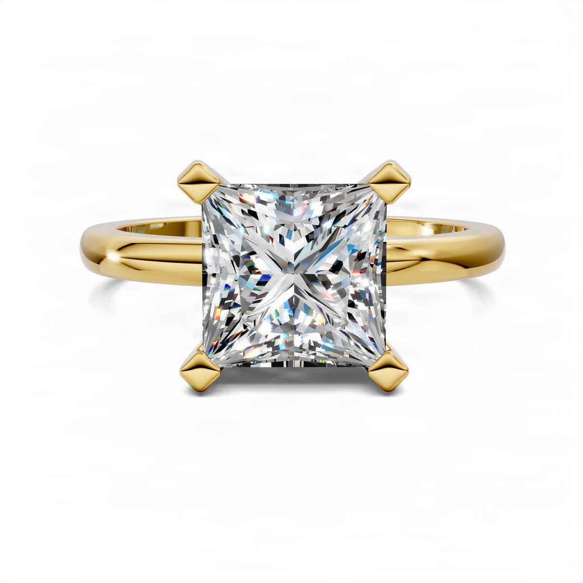 Princess-cut solitaire diamond ring with four-prong setting and polished split band, yellow gold