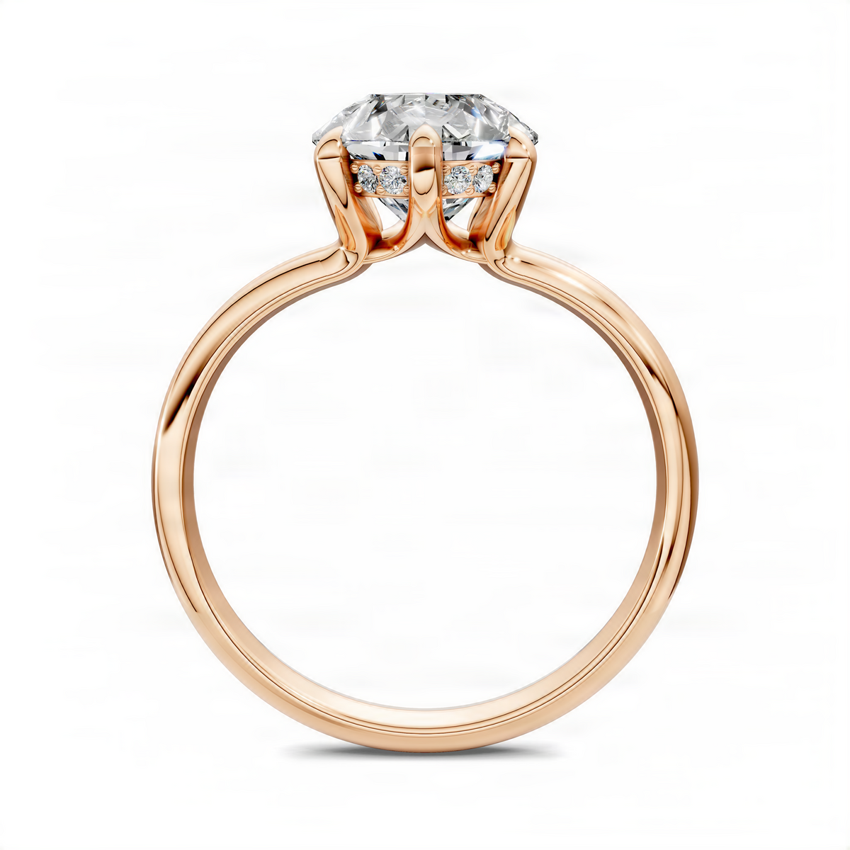 Rose gold diamond ring with oval center stone and prong-set side stones