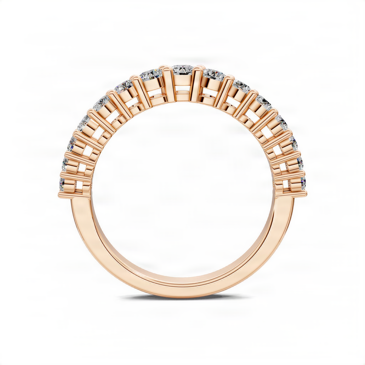 Rose gold-tone band ring with clear round stones in raised sections