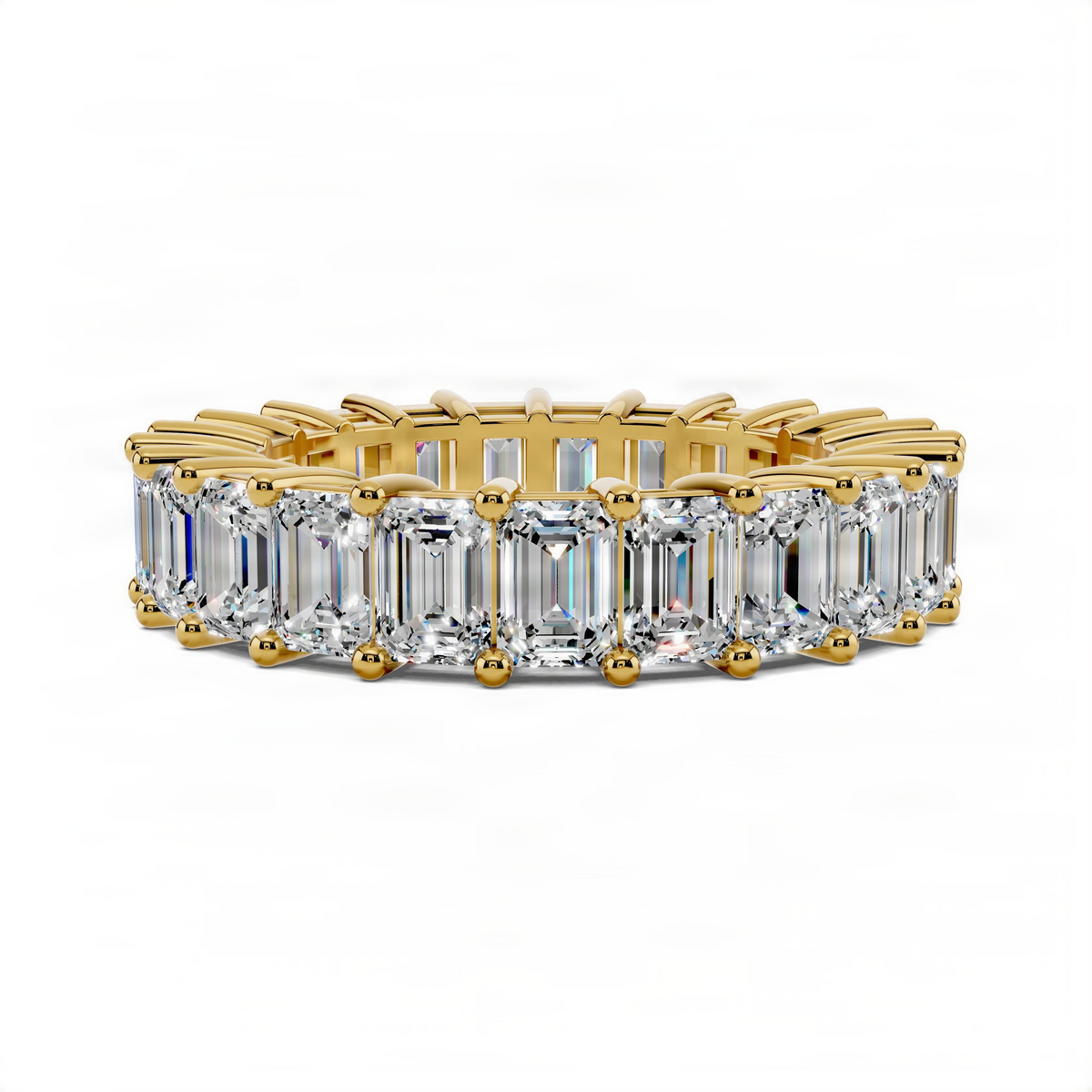 Yellow gold eternity band ring with emerald-cut gemstones, straight-on view