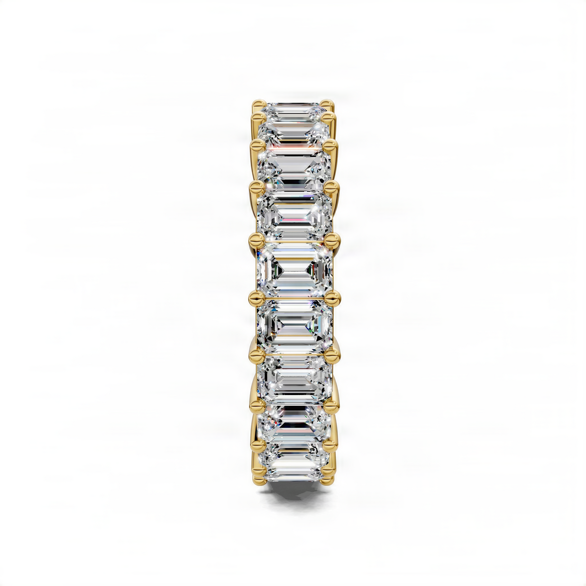 Yellow gold eternity band ring with emerald-cut gemstones in prong settings