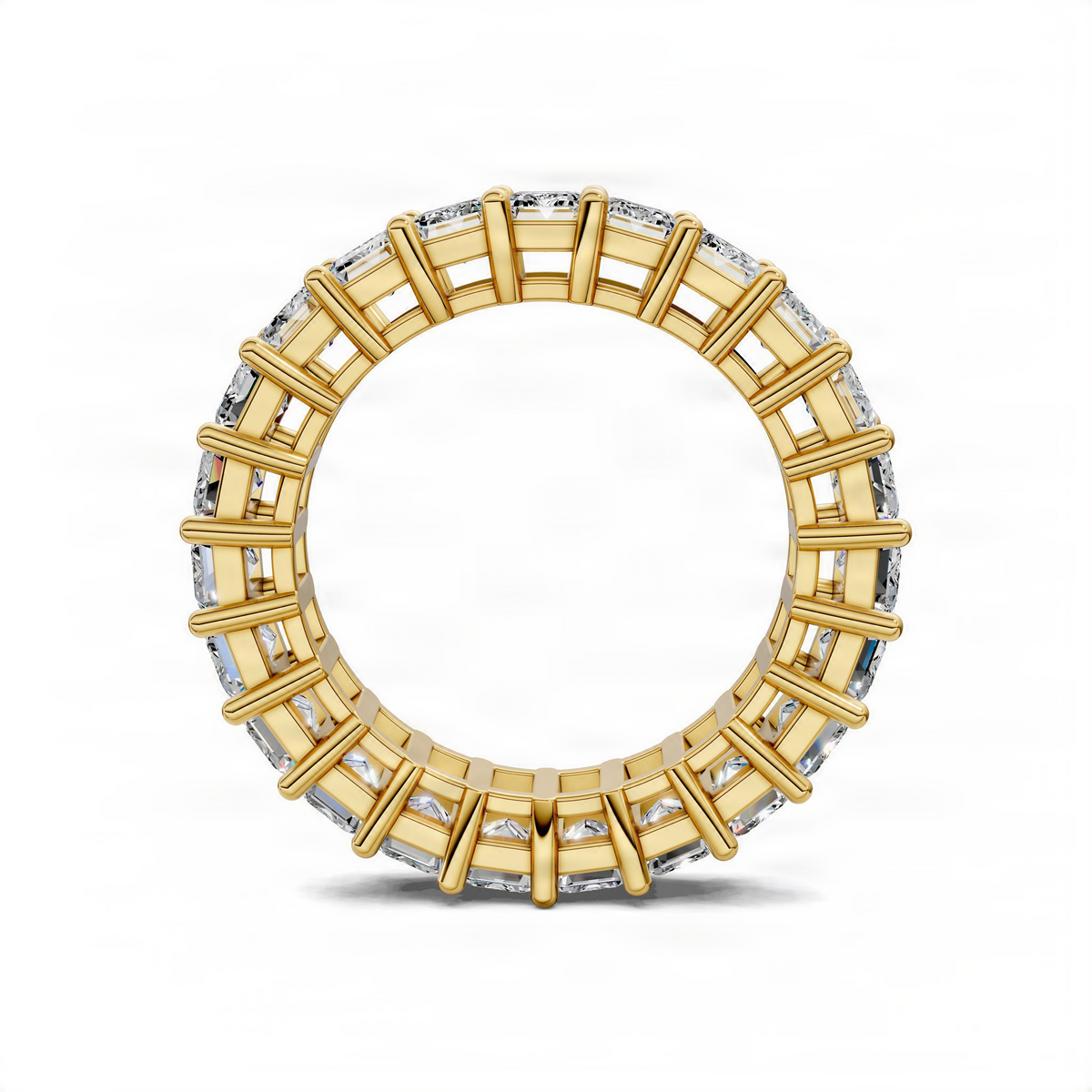 Yellow gold eternity band ring with emerald-cut gemstones in prong settings