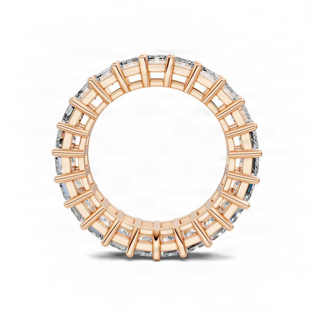 Rose gold eternity band ring with emerald-cut gemstones in prong settings