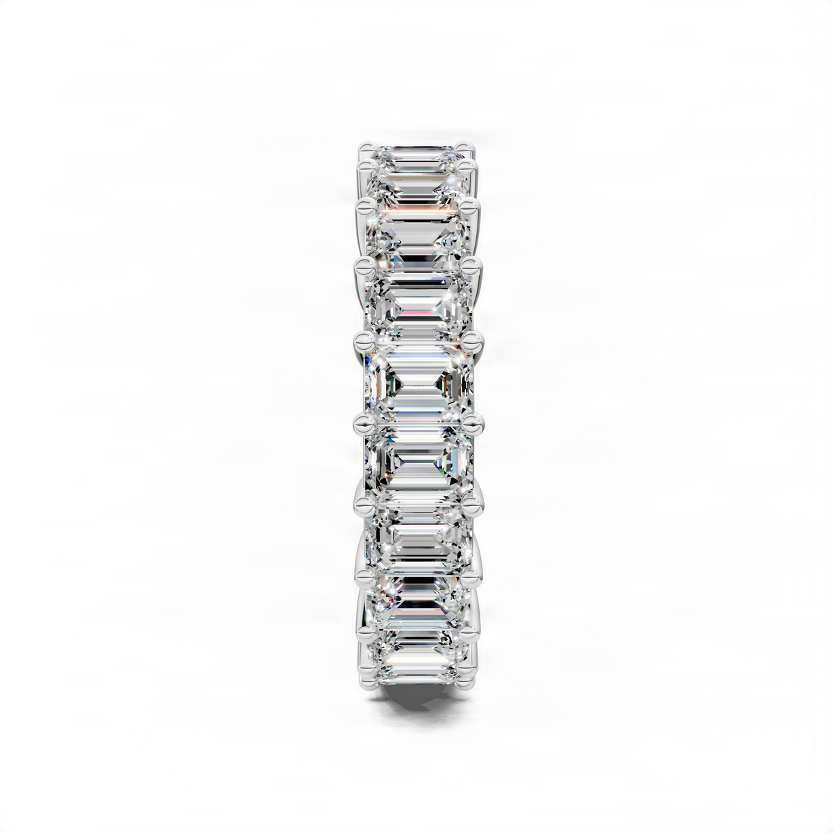 White gold eternity band ring with stacked emerald-cut gemstones in prong settings