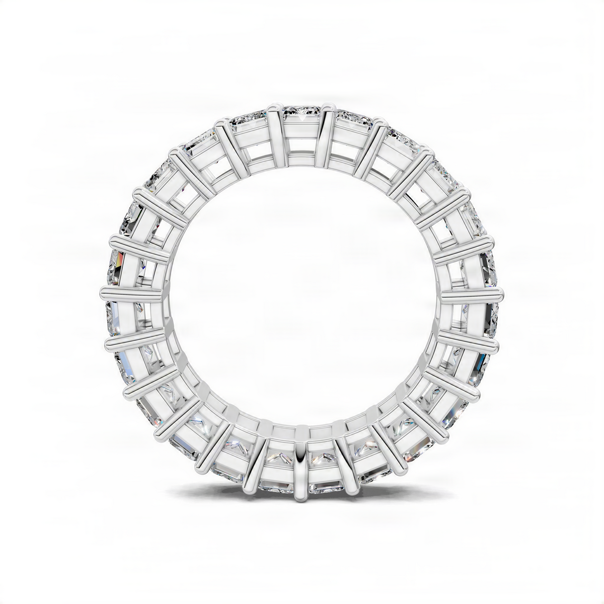 White gold eternity band ring with emerald-cut gemstones, circular band view