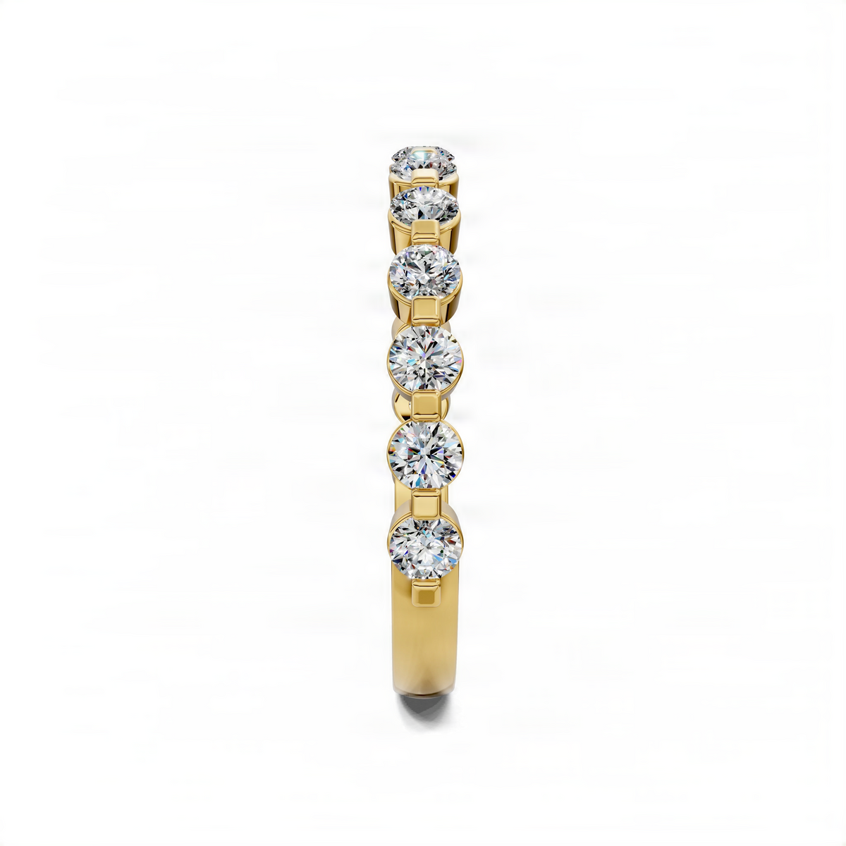Yellow gold wedding band with bezel-set round diamonds along the center row