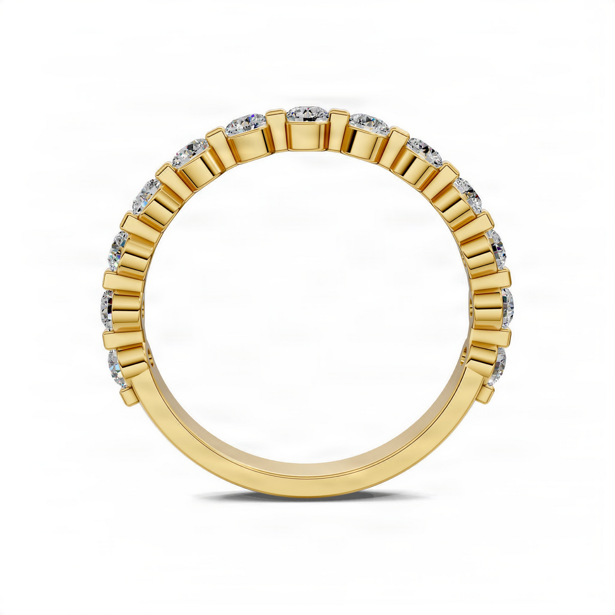 Yellow gold wedding band with round bezel-set diamonds in a continuous row