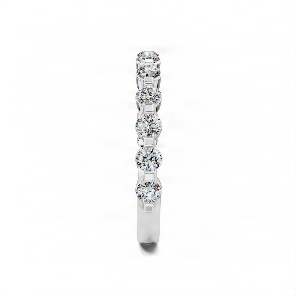 White gold wedding band with bezel-set round diamonds along the center row
