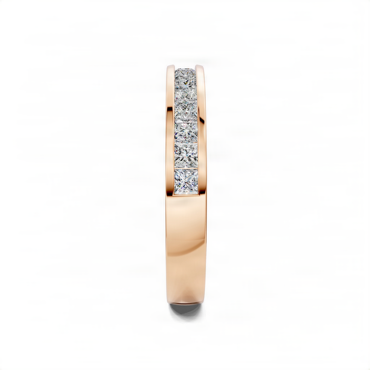 Rose gold wedding band with channel-set baguette diamonds on the outer edge