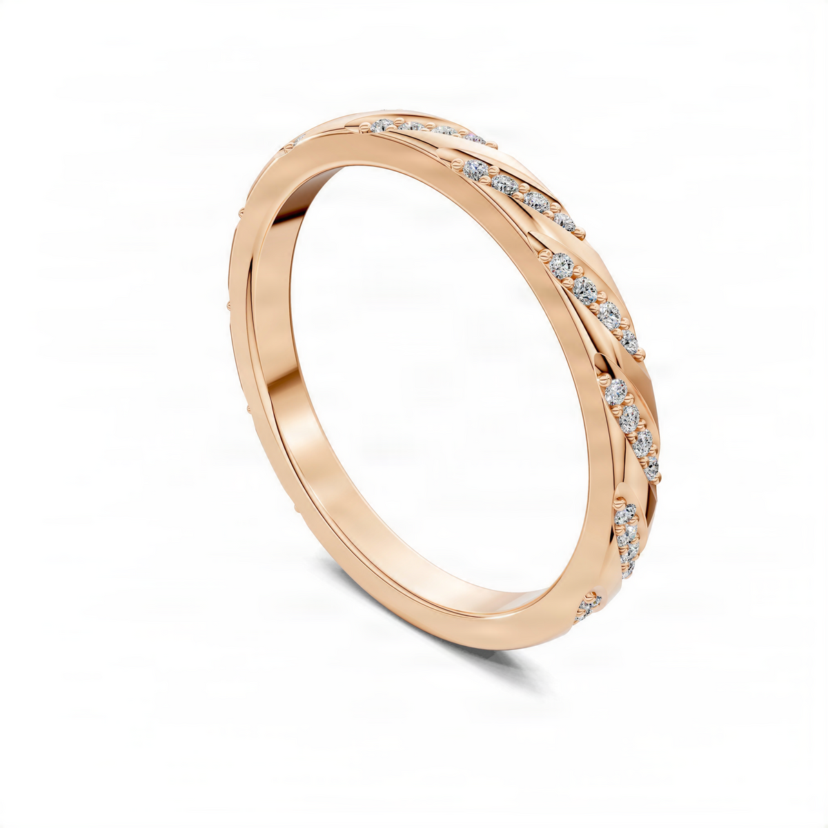 Opes wedding band in rose gold with pavé diamonds along one edge
