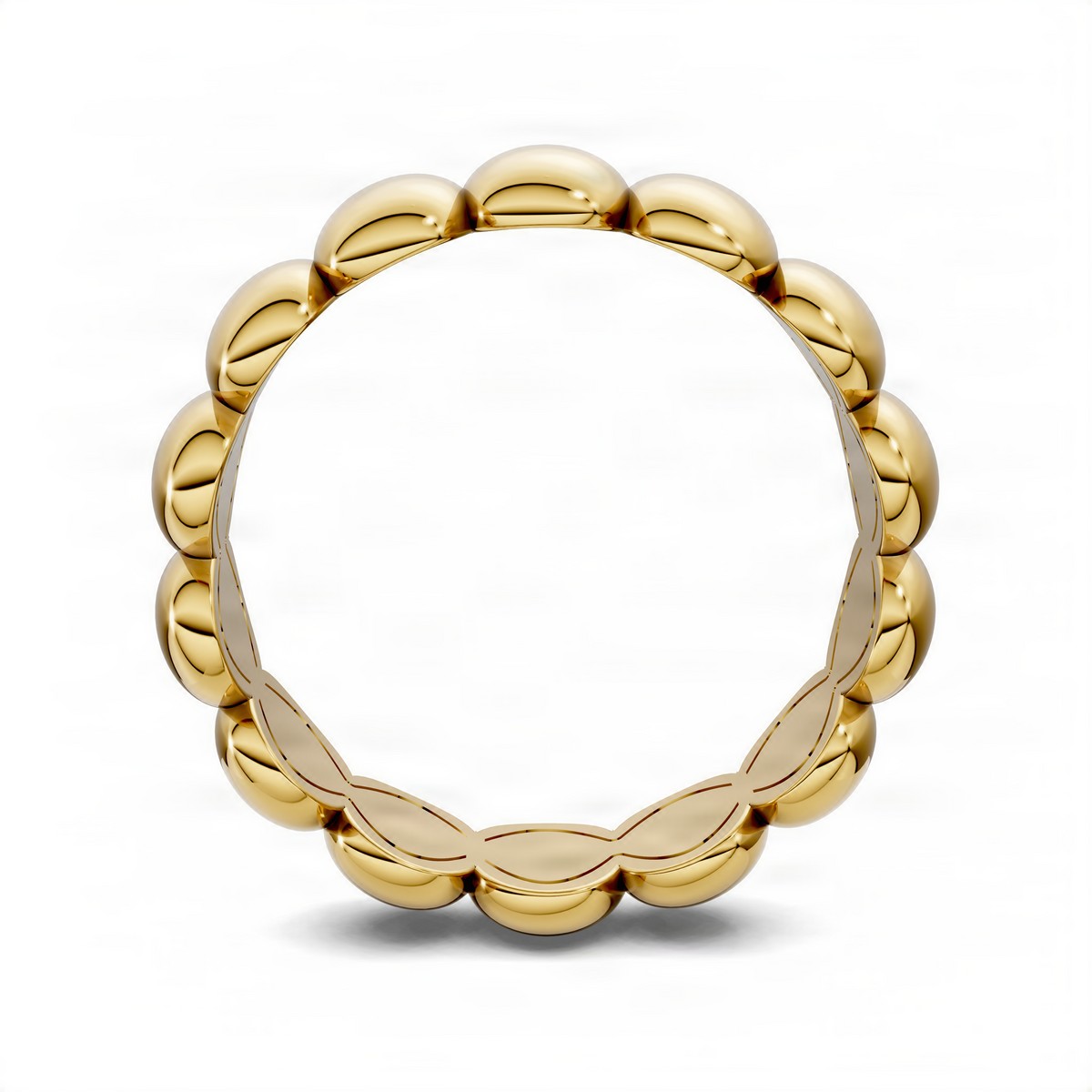 Yellow gold puffed stacker ring, top view showing continuous oval-link band.