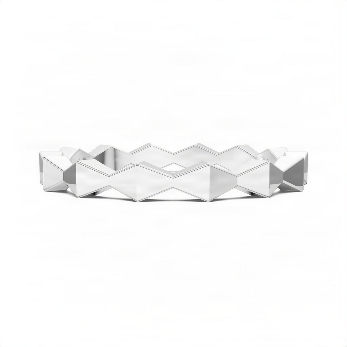 Geometric sculpture-style ring with polished facets, silver-tone metal band.