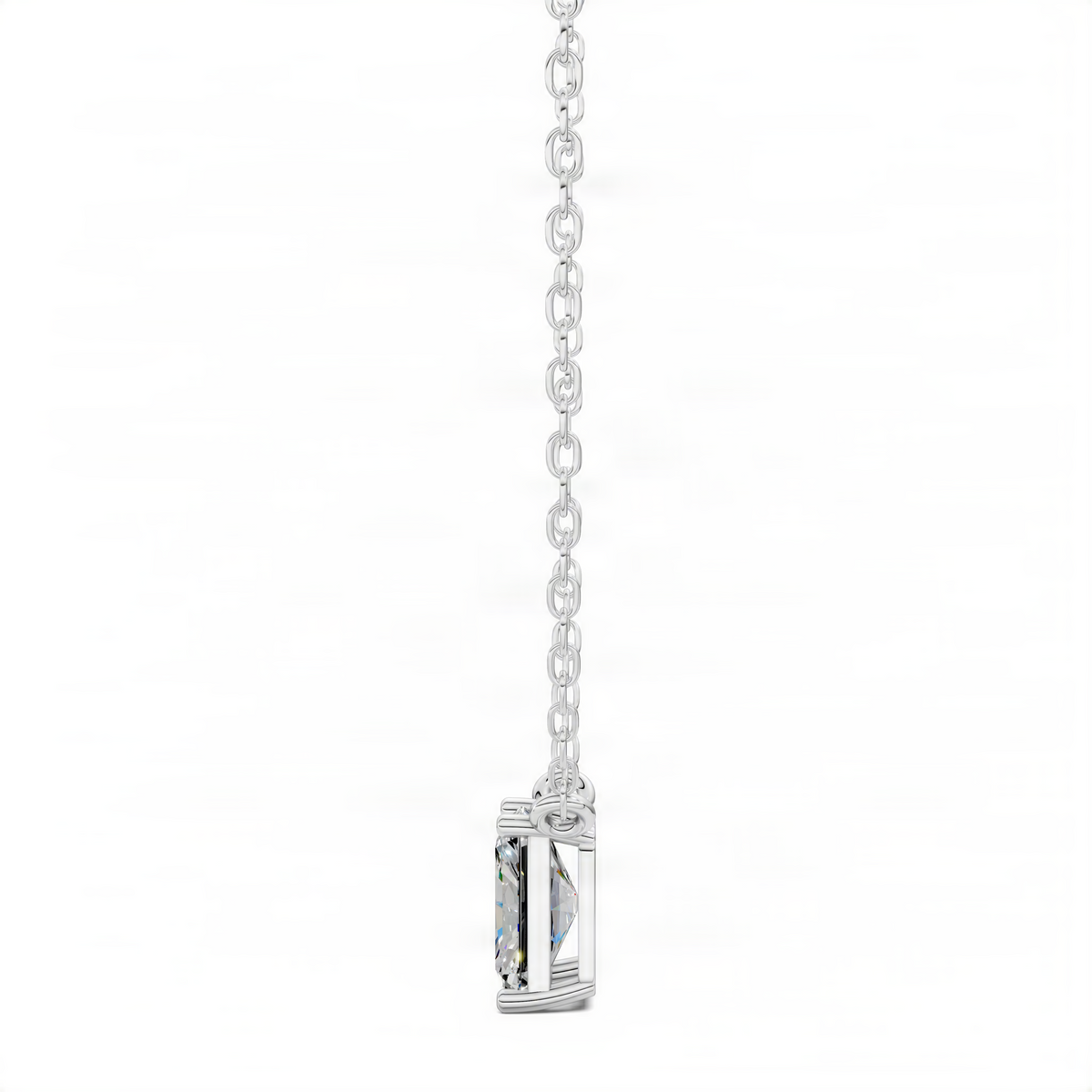 Radiant-cut diamond pendant side view on silver-tone chain, prong-set square setting
