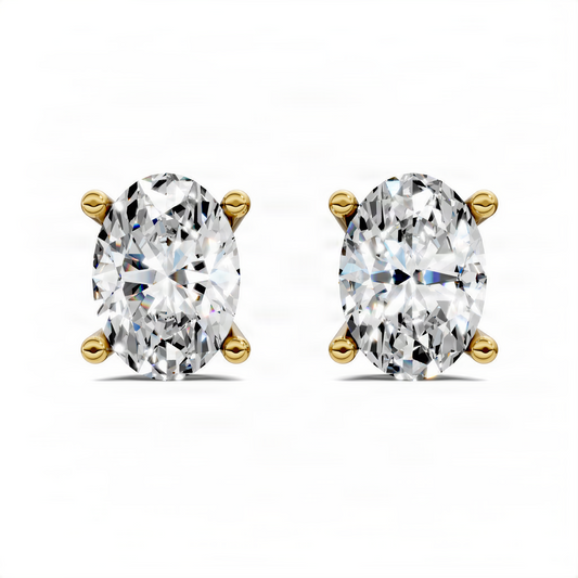 Oval-cut diamond stud earrings in yellow gold basket prongs