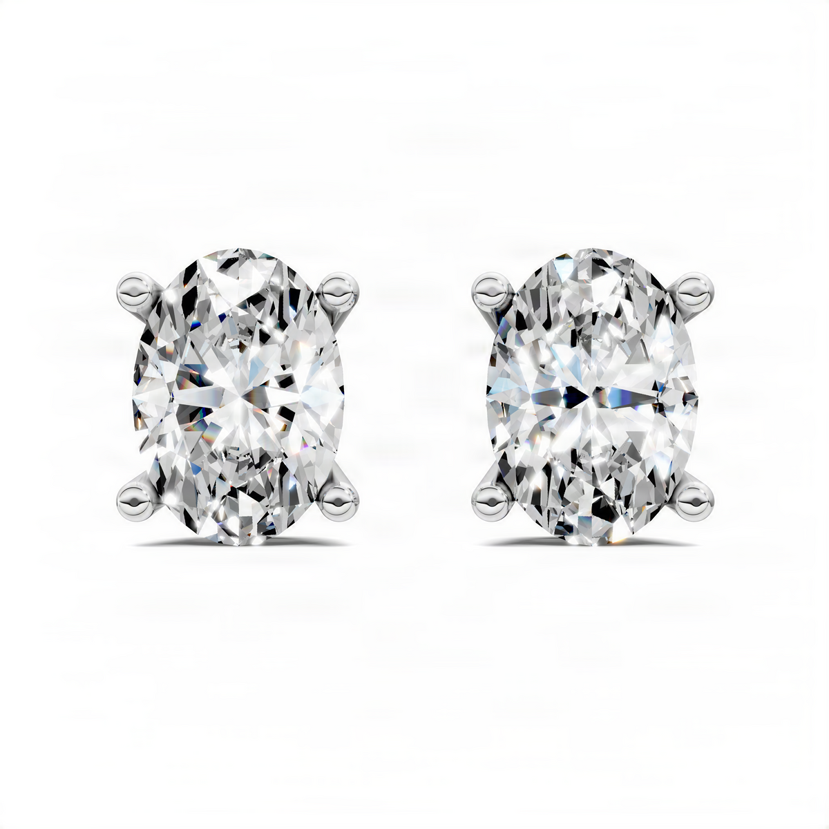 Oval-cut diamond stud earrings in white metal basket settings