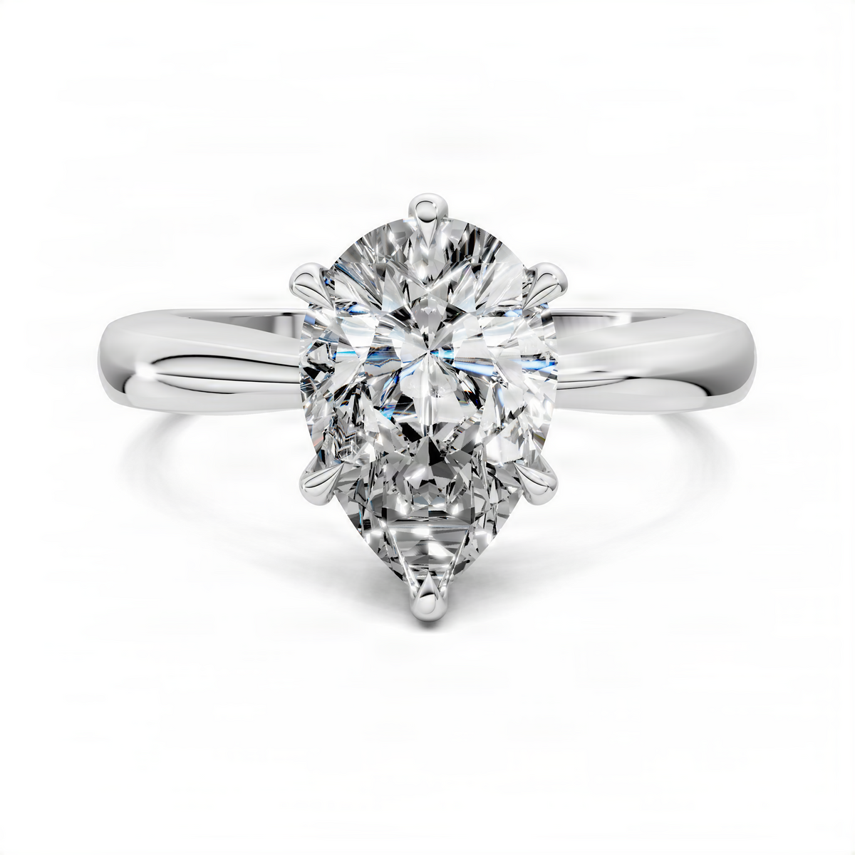 Pear solitaire ring with large pear-cut clear center stone and tapered band, silver-tone.