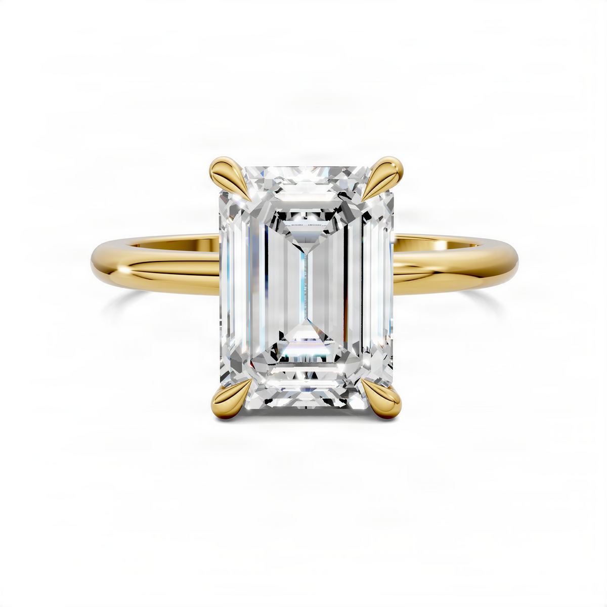 Yellow gold engagement ring with emerald-cut center stone and leaf accent prongs