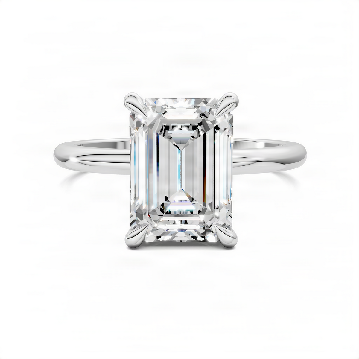 White gold engagement ring with emerald-cut center stone and leaf accent prongs
