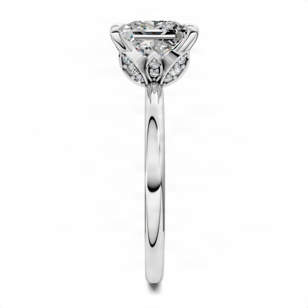 White gold princess-cut diamond ring with leaf-accent prongs and side stones