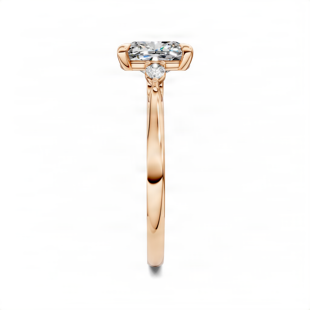Rose gold three-stone cushion ring with large center stone and two side stones