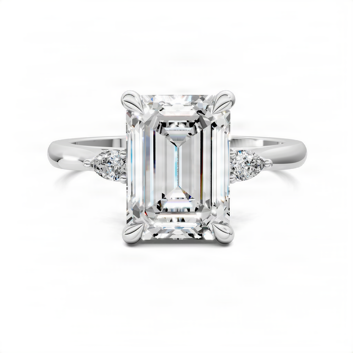White gold three-stone engagement ring with emerald-cut center stone and two side diamonds